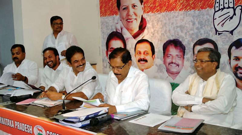 Congress general secretary KC Venugopal with KPCC chief Dr G Parameshwar during a party meeting (Photo: DC0