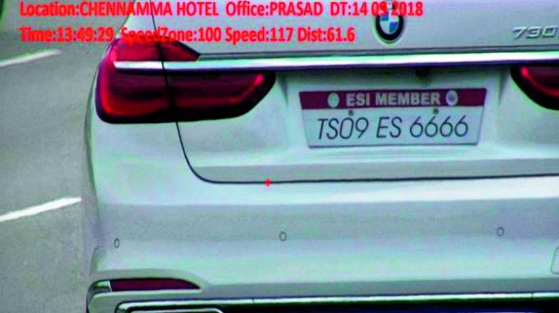 A BMW car with pending traffic fines is seen with an ESI tag.
