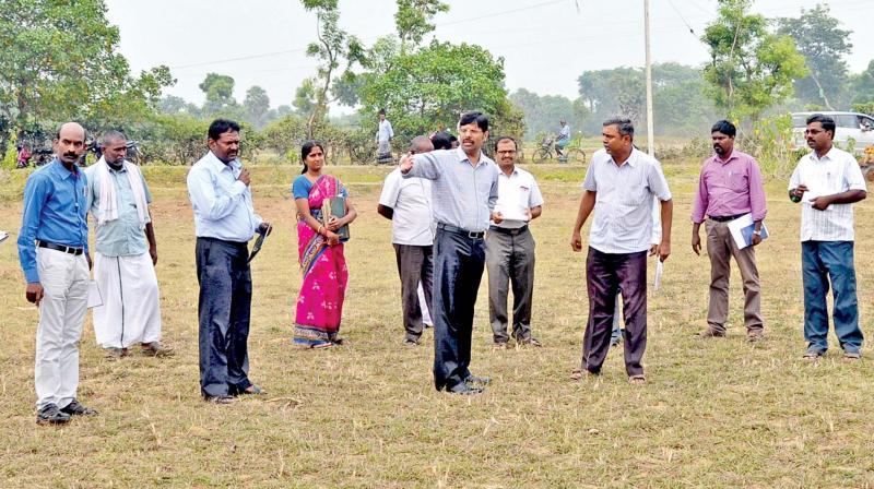 Ariyalur district collector A. Saravanavelraj gives instructions to revenue officials to clear the Mangalam lake bed of encroachments.