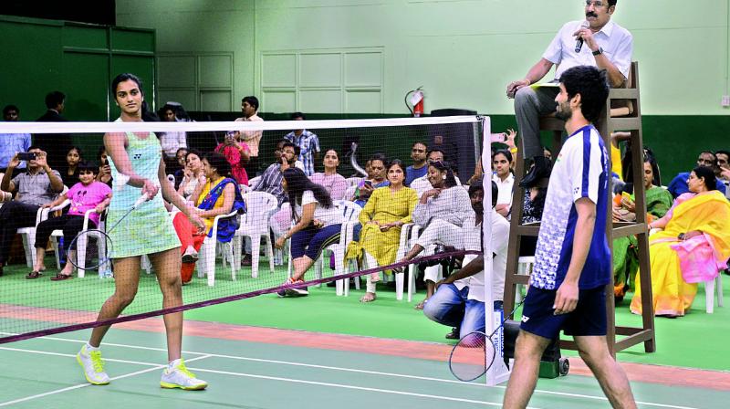 P. V. Sindhu and Srikanth Kidambi in action after the inauguration of an air-conditioned badminton courts at the Film Nagar Culture Centre in Hyderabad on Monday evening.