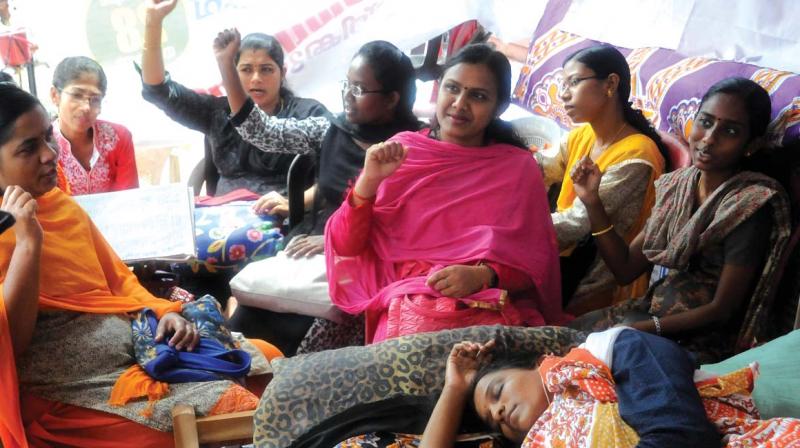 Praveena Raj, a member of Indian Nurses Association (INA) observes a hunger strike in front of secretariat demanding fair wages, in Thiruvananthapuram  on Friday. (Photo: A. V. MUZAFAR)