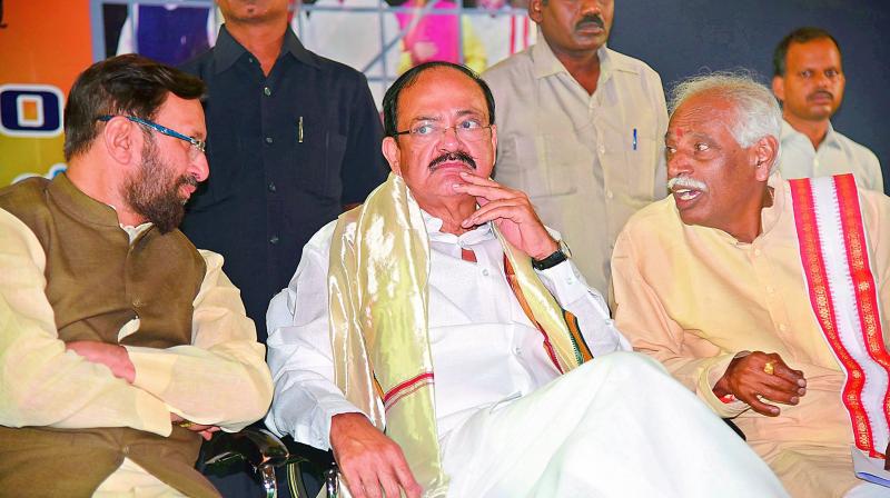 Union ministers Prakash Javadekar (left), M. Venkaiah Naidu (centre) and Bandaru Dattatreya at a function, in Hyderabad on Sunday. 	 GANDHI