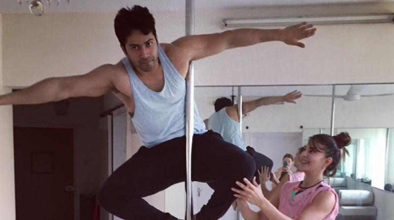 Varun Dhawan with Jacqueline Fernandez during their pole dancing practice!
