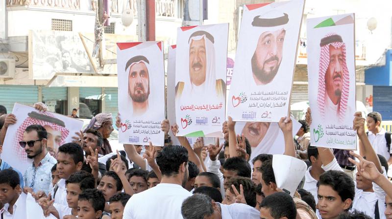 Yemeni protesters carry placards bearing portraits of Gulf leaders during a demonstration in support of Saudi Arabia, after the Saudi-led coalition said Yemeni rebels launched a ballistic missile that was shot down near the holy city of Mecca. (Photo: AFP)