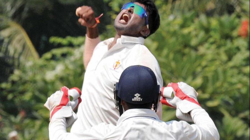 K. Gowtam exults after taking a wicket on Sunday. 	(Photo: PTI)