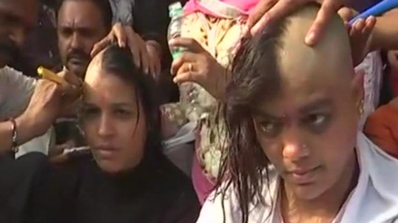 Teachers from across the state had gathered at the Bharat Heavy Electricals Ltd (BHEL) Jamboorie ground where several of them tonsured their heads. (Photo: ANI)