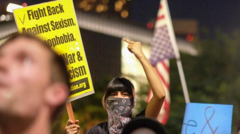 Demonstrators gather to protest a day after President-elect Donald Trumps victory at a rally outside Los Angeles City Hall in Los Angeles, California, on Wednesday. (Photo: AFP)