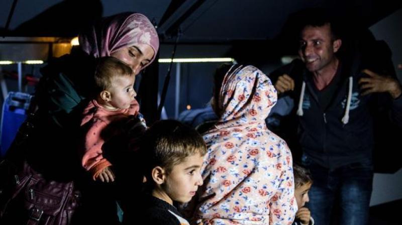 Refugees arrive at the Kokkinotrimithia refugee camp, some 20 kilometres outside the Cypriot capital Nicosia, on Thursday, after they were rescued by police off the northwestern coast of the island. (Photo: AFP)
