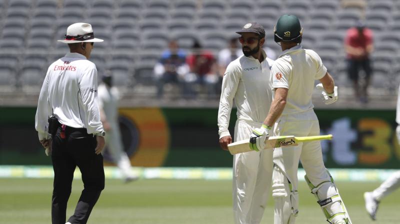 During the 71st over bowled by Jasprit Bumrah, the respective captains were seen exchanging words after Kohli decided to field close to the non-striker and Gaffaney had to step in. (Photo: AP)