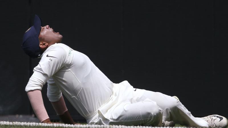 haw managed to get under the ball and catch it, but spilled the chance whilst tumbling over the ropes. In the process, he injured his ankle. (Photo: AP)