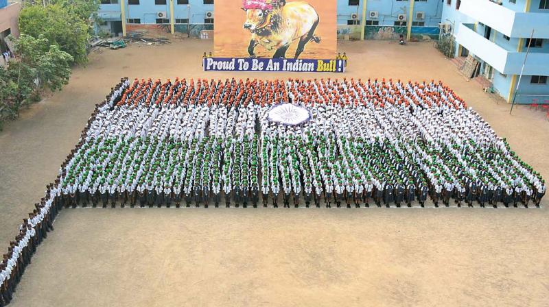 Students of Everwin Vidyashram, Kolathur, stand together to form the national flag on the eve of Republic Day. (Photo: DC)