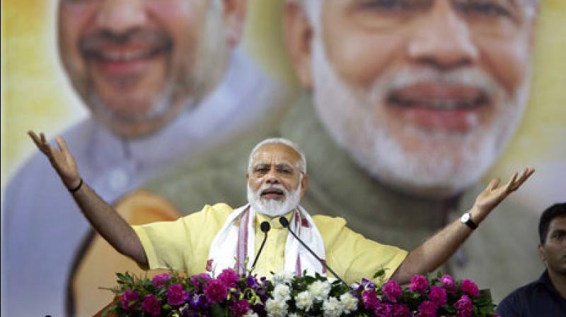 Prime Minister Narendra Modi addresses a gathering in Gauhati, capital of the northeastern Indian state of Assam, Friday. (Photo: PTI)