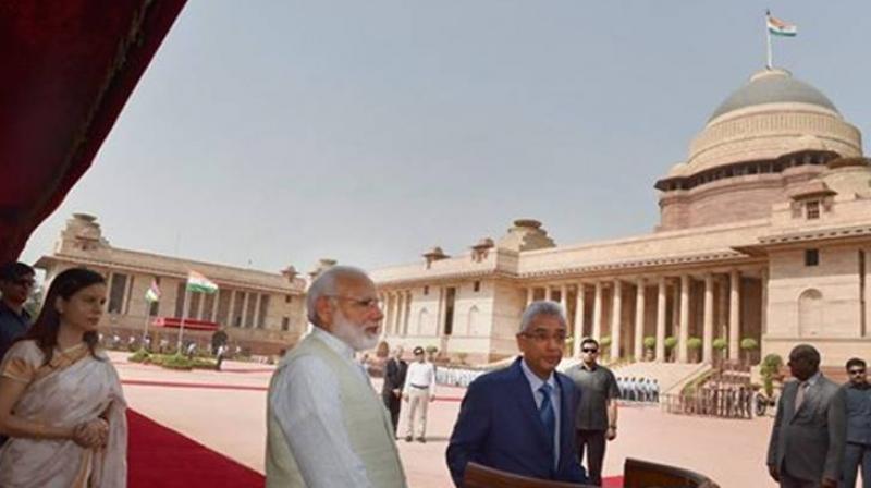Mauritian PM Pravind Kumar Jugnauth addresses media as his wife Kobita Jugnauth and Prime Minister Narendra Modi look on during the ceremonial reception at the forecourt of Rashtrapati Bhawan in New Delhi on Saturday. (Photo: PTI)