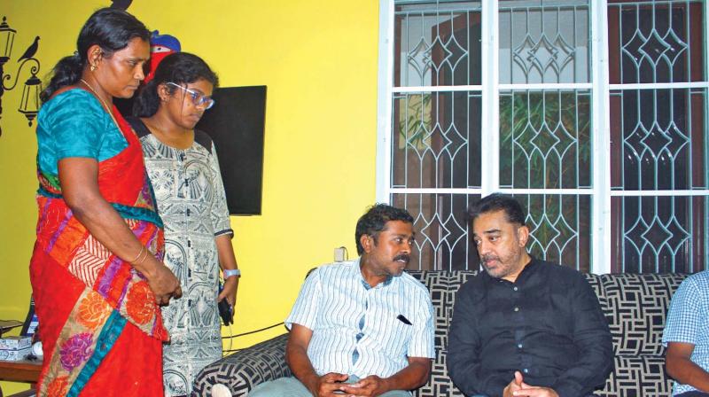 Makkal Neethi Maiam party founder Kamal Haasan visits the family of a girl who died in Kurangani hills fire tragedy (Theni), in the city on Saturday. 	 DC