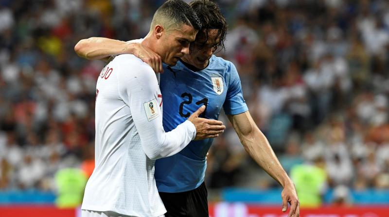 Cavani was struggling to continue after a severe calf pain just after the hour mark and when it became evident that the PSG star could not continue, Ronaldo rushed to help his opponent.(Photo: AP)