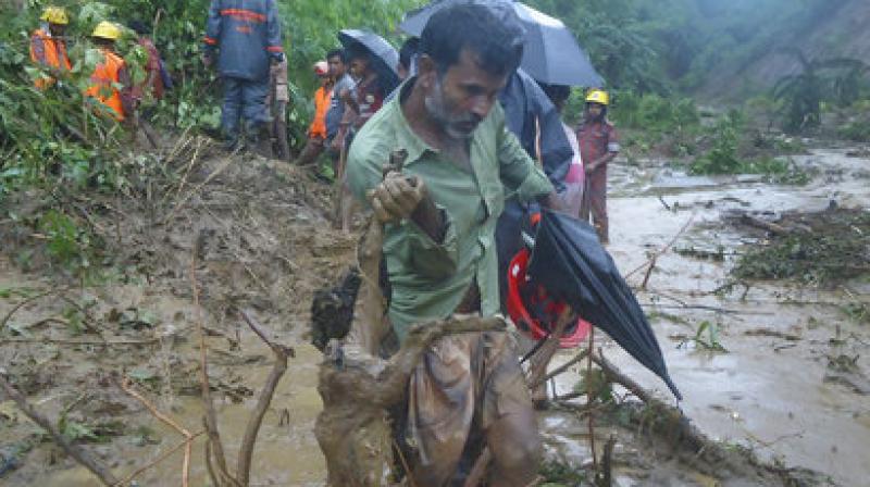 Local people said a landslide pushed 15 army men down to around 30 feet, killing four instantly while a military spokesman in Dhaka said an army major and a captain were among four of their dead personnel. (Photo: AP)