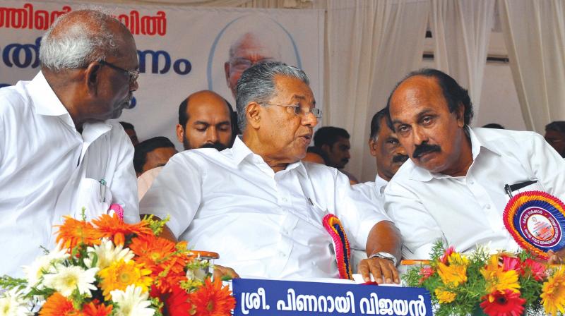 Power Minister M.M. Mani, Chief Minister Pinarayi Vijayan and revenue minister E. Chandrasekharan during the function organised to declare state as totally electrified in Kozhikode on Monday. 	(Photo:  DC)