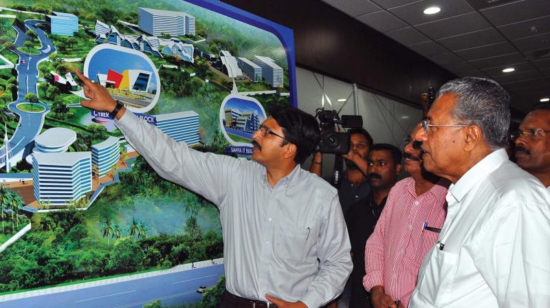 Chief Executive Officer Cyber Park Rishikesh Nair briefs Chief Minister Pinarayi Vijayan of the facilities and master plan of the Government Cyber Park, Kozhikode on Monday as part of the inaugural ceremony. (Photo: Viswajith K)