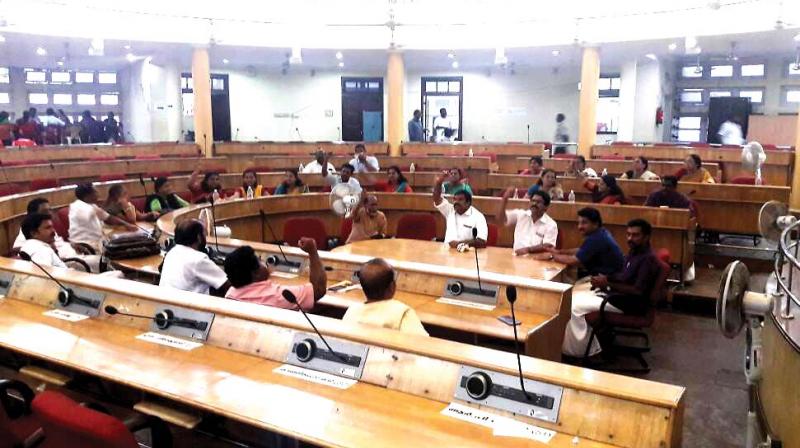BJP councillors shouting slogans in the Corporation council hall on Monday. 	(Photo:  DC)