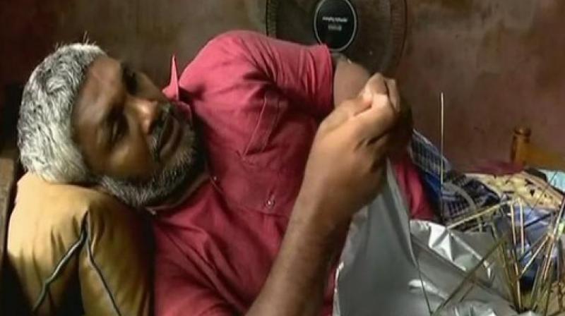 This specially-abled man has been making umbrellas for the last five years, and with the help of Unni and Manoj Pillai, he has been selling his products through platforms like Facebook and WhatsApp. (Photo: ANI)