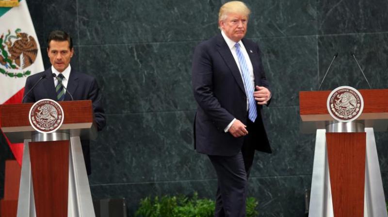 US President Donald Trump and Mexicos President Enrique Pena Nieto during an earlier meeting in Mexico City. (Photo: AP)