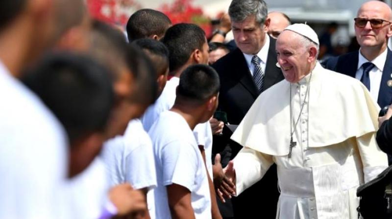 Pope Francis greets young detainees before leaving Las Garzas youth detention centre on the outskirts of Panama City, during his visit to Panama for World Youth Day. (Photo:AFP)