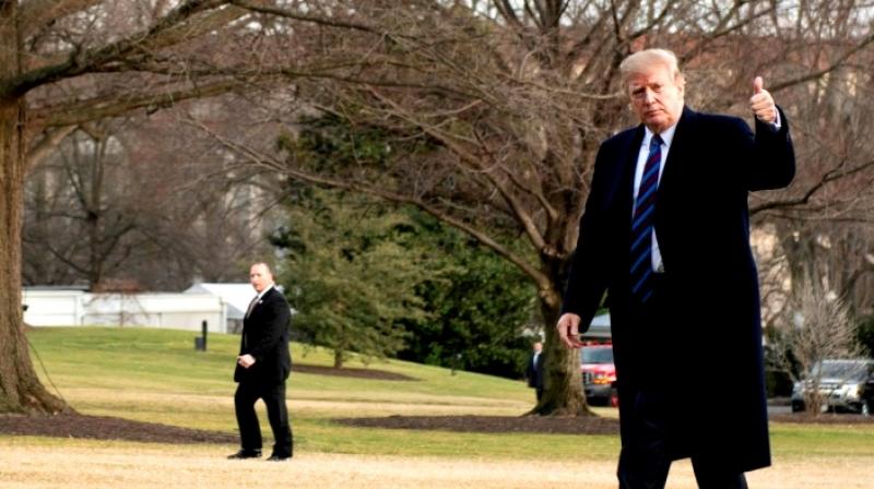 US President Donald Trump gives a thumbs up as he returns to the White House after his annual physical exam on February 8, 2019. (Photo: AFP)
