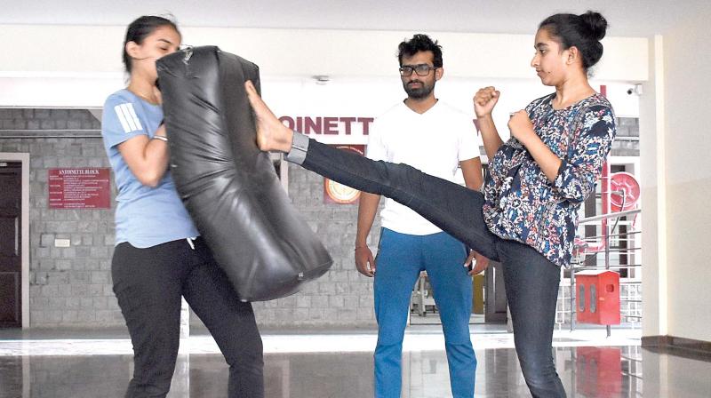 Instructor Ranjith and student Shweta at Mount Carmel College during a self defence class