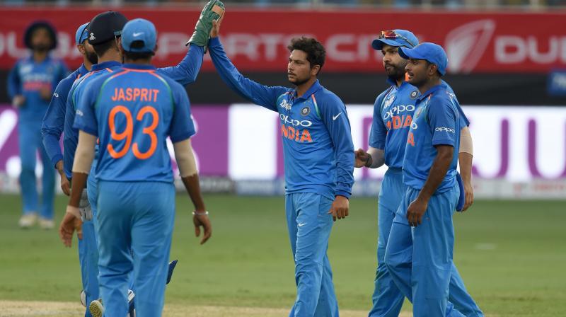 The spinners have been on a roll with Yuzvendra Chahal (5 wickets at 4.61 runs per over) and Kuldeep Yadav (5 wickets in 4.01 runs per over) have been tight as usual while Jasprit Bumrah (7 wickets with 3.37 runs per over) has been exceptional at the death with his yorkers. (Photo: AFP)