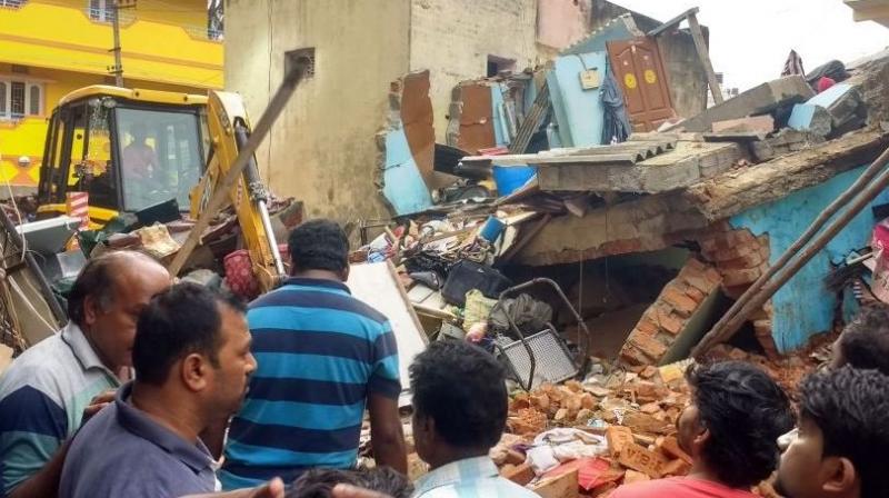 Portion of a residential building collapsed in Ejipura area. (Photo: ANI | Twitter)