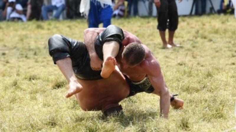Oil wrestlers participate in the annual tournament at the Sarayici arena in Edirne, Turkey. (Photo: Instagram / zulkif07)