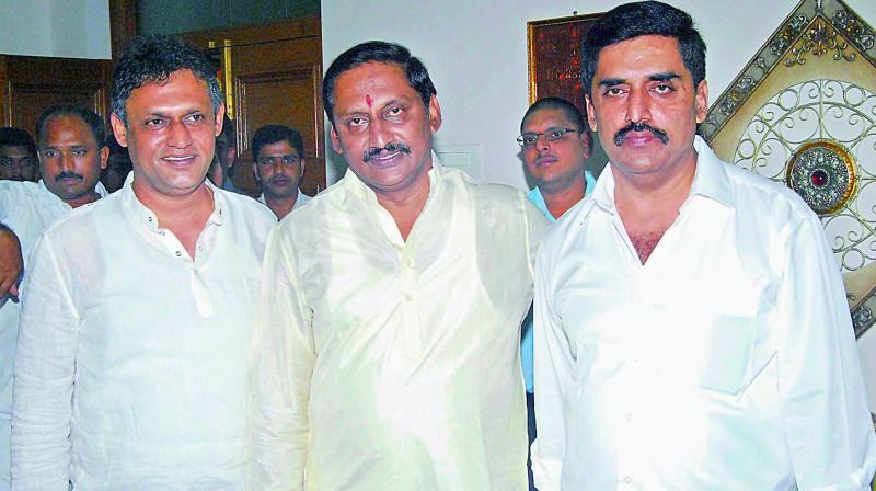 Former chief minister Kiran Kumar Reddy (centre) flanked by his brother Kishore (right) who announced he would be joining the TD and Santosh, a businessman in Bengaluru.