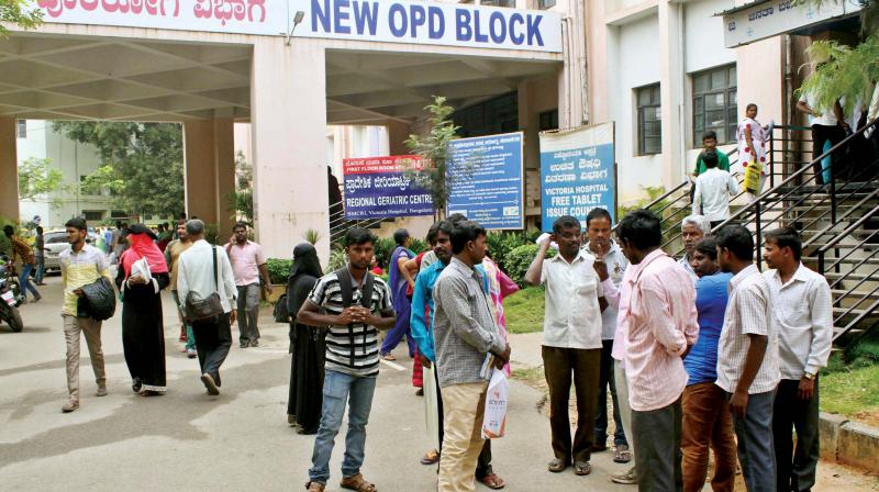 Patients and their relatives at a hospital in Bengaluru on Thursday. (Photo: DC)