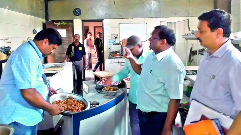 GHMC officials inspect meat dish served by a hotel in the city. Fines between Rs 10,000 to Rs 40,000 were handed over to various eateries, by inspectors.