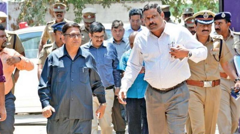 Deputy Election Commissioner Umesh Sinha along with TN chief electoral officer, Rajesh Lakhoni, and district election officer D. Karthikeyan arriving at Corporation Model school at RK Nagar. (Photo: DC)