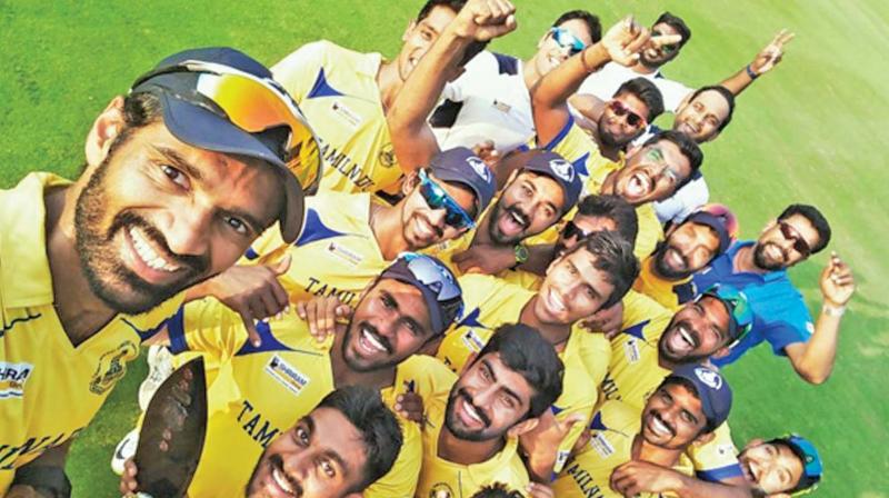 Members of Tamil Nadu cricket team celebrate after winning the Deodhar Trophy at Vizag on Wednesday. Tamil Nadu beat India B by 42 runs to become the first state side to win the three-team one-day tournament. Wicket-keeper batsman Dinesh Karthik won the man of the match award for slamming a century in the final.