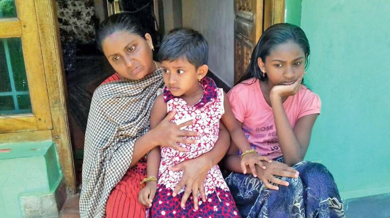 Lizy, whose husband, Edward Subin, was detained in August 2016, and her daughters wait for her husbands return.