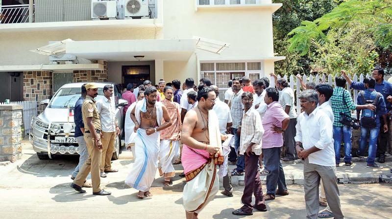 Vedic scholars and priests coming out from former Chief Minister O. Paneerselvams new house at Venus colony near Poes Garden, after a special pooja and house warming ceremony on Thursday. (Photo: DC)