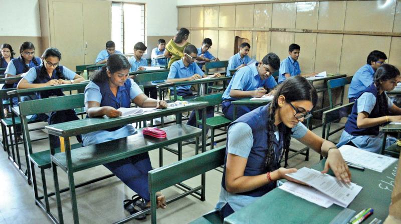 Students appear for class XII CBSE exam at Bhaktavatsalam Vidyashram Korattur on Thursday. (Photo: DC)