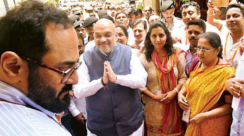 BJP president Amit Shah arrives at party office in Bengaluru on Thursday. 	 (Photo:KPN)