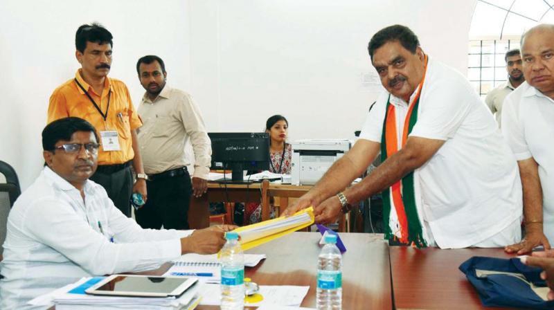Congress candidate Ramanath Rai files his nomination papers at Bantwal on Thursday.  (Photo:KPN)