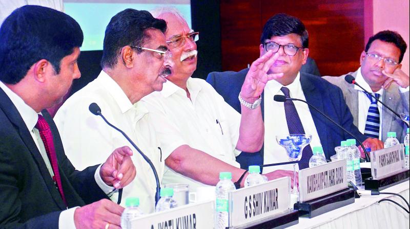 Civil aviation minister P. Ashok Gajapathi Raju interacts with Vizag MP Kambhampati Haribabu as he takes part in an interactive session organised by CII, Visakhapatnam Zone, at a hotel in Visakhapatnam on Monday. (Photo: DC)