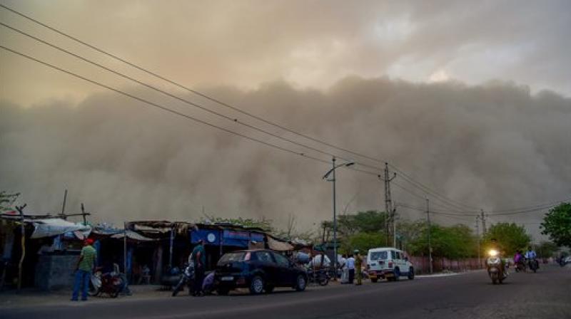 A dust storm is seen building up over the city of Bikaner on Monday. In a fresh advisory by the India Meteorological Department (IMD), dust storm and heavy rain likely at isolated places in Uttar Pradesh, Jammu and Kashmir, Punjab, Himachal Pradesh, western Rajasthan and states in North-east. (Photo:PTI)