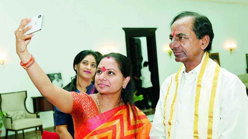 Nizamabad MP K. Kavita takes a selfie with her father and Telangana state Chief Minister K. Chandrasekhar Rao on the occasion of latters birthday, at Pragati Bhavan in Hyderabad on Saturday.