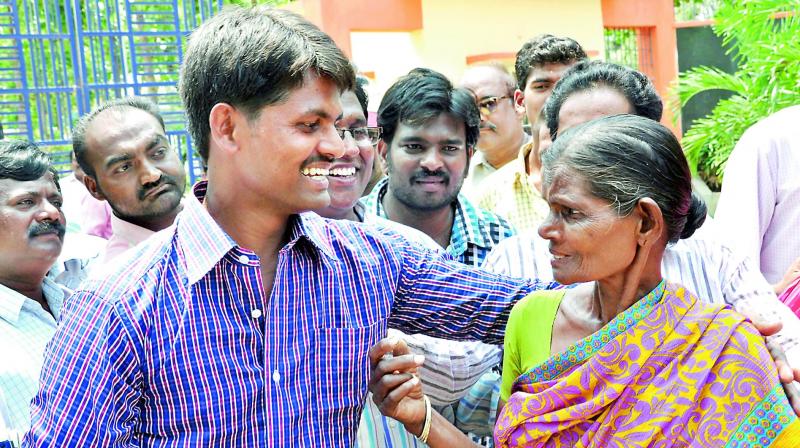 P.Satyam Babu with his mother Mariyamma after his release from the Central Prison in Rajahmundry on Sunday. (Photo: DC)