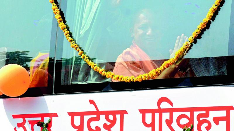 UP Chief Minister Yogi Adityanath rides a new UPSRTC bus flagged off by him in Lucknow on Sunday. (Photo: PTI)