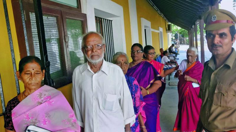 French nationals line up in Puducherry on Sunday for voting during the second round of French presidential elections. (Photo: PTI)