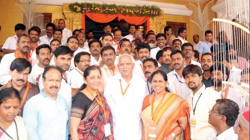 State BJP president B.S. Yeddyurappa with union minister Nirmala Sitharaman and MP Shobha Karandlaje after the state units executive committee meeting in Mysuru on Sunday. (Photo: KPN)