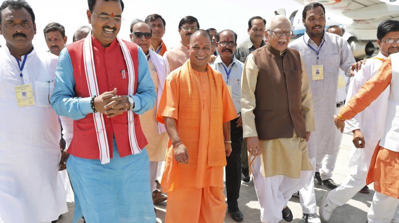 Uttar Pradesh Chief Minister Yogi Adityanath, center, arrives at the Bamrauli airport. (Photo: AP)