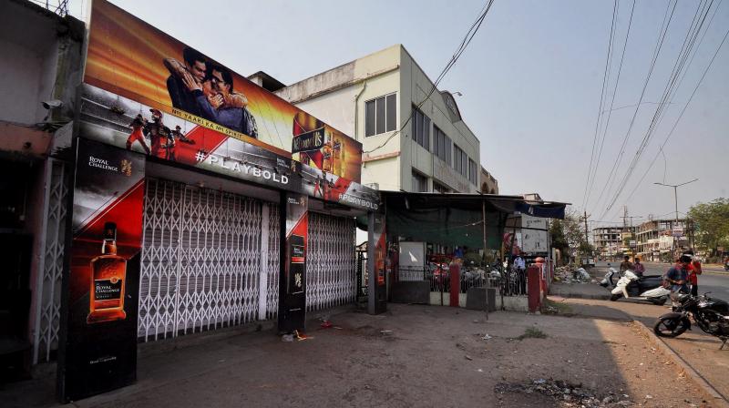 A closed liquor shop following the directive of the Supreme Court to shut liquor vends located within 500 meters of national and state highways in Nagpur, Maharashtra. (Photo: PTI)